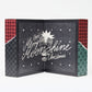 Micro adventskalender 2025 op een witte achtergrond. Open om de tekst 'Cheers, Merry Moonshine Christmas' te laten zien met een gescheurd inpakpapierpatroon aan de buitenkant.