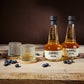 O'Donnell Blueberry Moonshine, O'Donnell en St.Kilian, hergestellt mit Single Malt Whisky naast een tumblerglas
